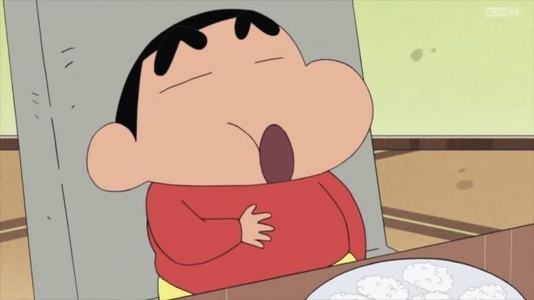 빨간 옷을 입은 만화 캐릭터가 입을 크게 벌리고 있는 장면